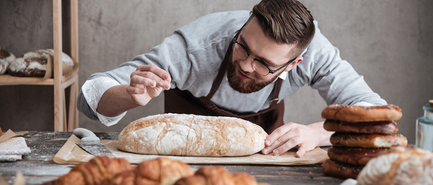 Picture of young concentrated man baker standing at bakery near bread. Looking aside. Schlagwort(e): adult, apron, baker, bakery, baking, bearded, bread, brown, caucasian, chef, day, flavor, flour, food, fresh, holding, indoors, industry, job, kitchen, loaf, male, man, mess, natural, occupation, organic, positive, preparation, product, profession, professional, staff, standing, uniform, work, worker, concentrated, aside, looking, adult, apron, baker, bakery, baking, bearded, bread, brown, caucasian, chef, day, flavor, flour, food, fresh, holding, indoors, industry, job, kitchen, loaf, male, man, mess, natural, occupation, organic, positive, preparation, product, profession, professional, staff, standing, uniform, work, worker, concentrated, aside, looking